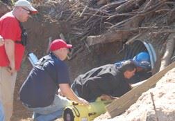 Emergency Services People Working in Drainage Tunnel